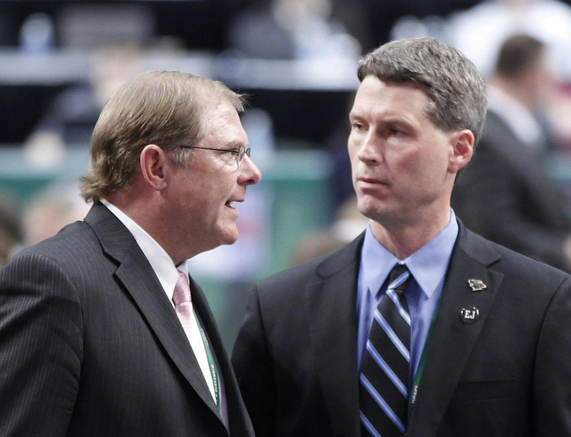 Minnesota Wild owner Craig Leipold, left, talks with Wild general manager Chuck Fletcher during the 2011 NHL draft in St. Paul.