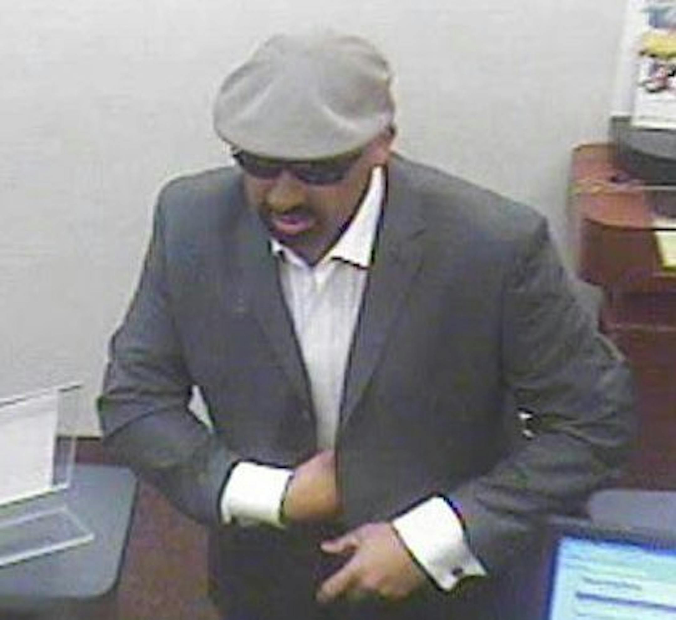 Authorities are searching for this person who is shown in surveillance video robbing a Guaranty Bank in Minneapolis.