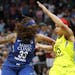 Minnesota Lynx guard Seimone Augustus (33) looks for a pass as Dallas Wings guard Allisha Gray (15) defends during the first half.
