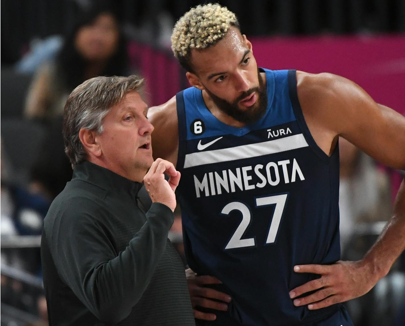 Minnesota Timberwolves head coach Chris Finch talks with Minnesota Timberwolves center Rudy Gobert (27) during the first half of an NBA preseason basketball game against the Los Angeles Lakers Thursday, Oct. 6, 2022, in Las Vegas. (AP Photo/Sam Morris)