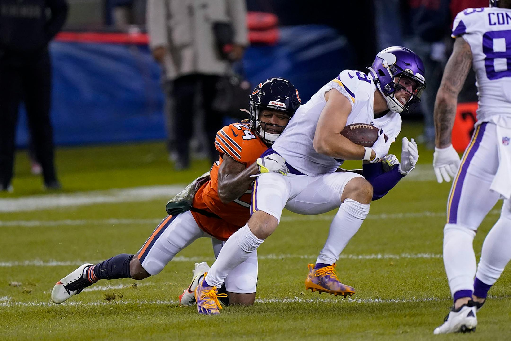 Minnesota Vikings wide receiver Adam Thielen (19) struggles for yardage after catching a pass as Chicago Bears cornerback Buster Skrine, left, defends during the first half of an NFL football game Monday, Nov. 16, 2020, in Chicago. (AP Photo/Nam Y. Huh)