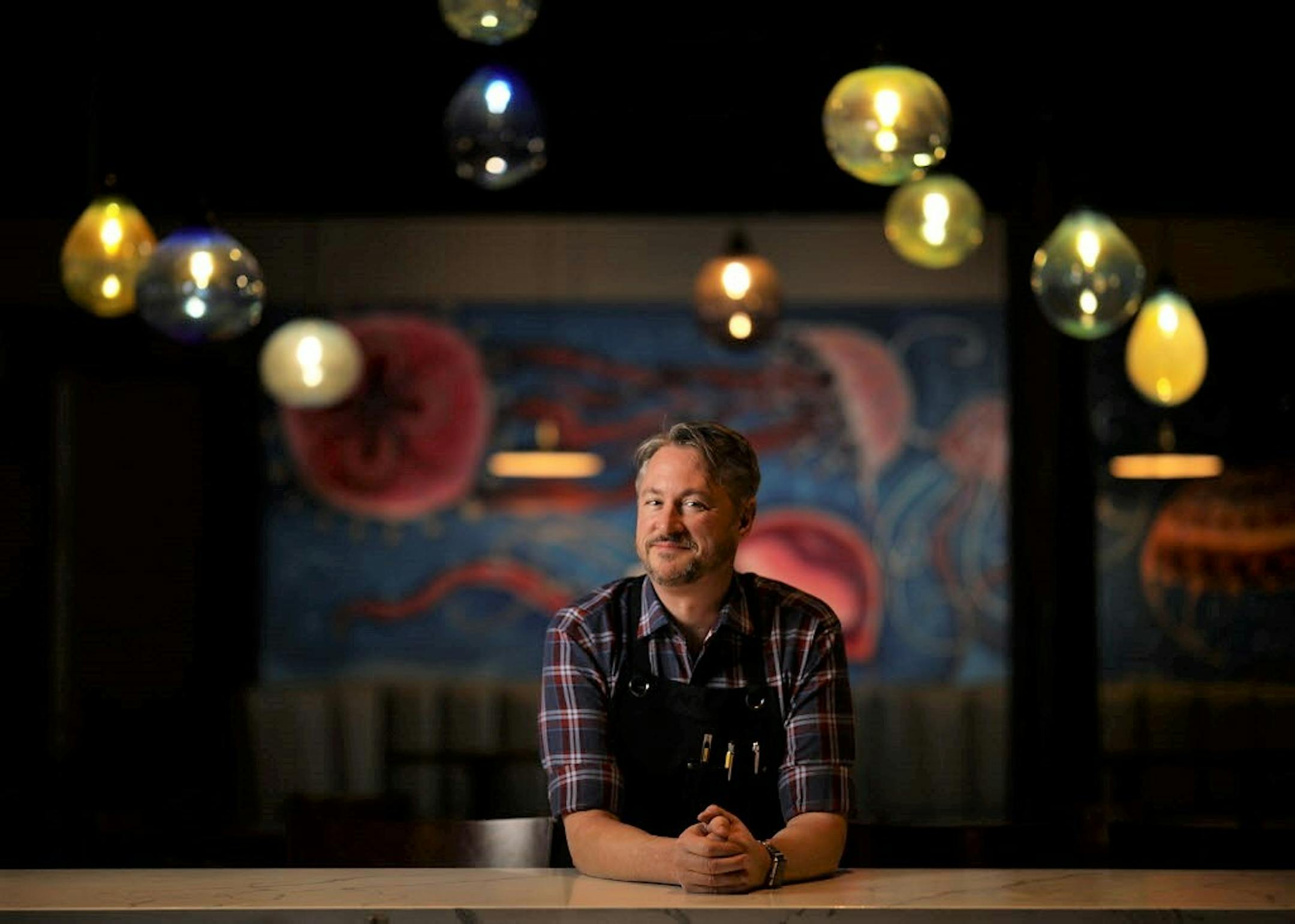 Chef Tim McKee at the bar in the dining room of his Octo Fishbar in St. Paul's Lowertown. ] JEFF WHEELER � jeff.wheeler@startribune.com Chef Tim McKee opened a new restaurant, Octo Fishbar in St. Paul's Lowertown this year. He was photographed in the dining room of the new concept Wednesday afternoon, December 13, 2017.
