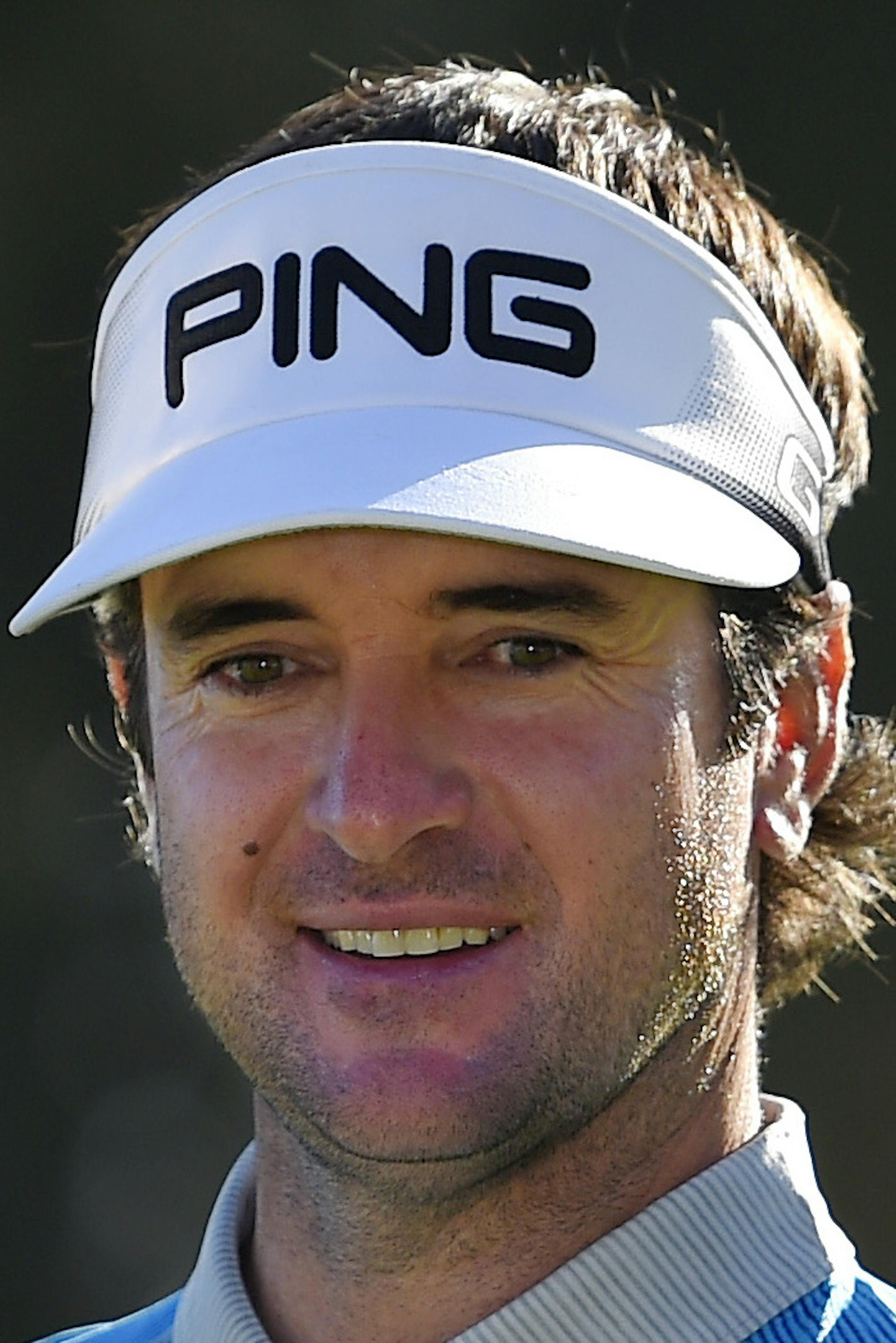 Bubba Watson holds his trophy after winning the Northern Trust Open golf tournament, Sunday, Feb. 21, 2016, in the Pacific Palisades section of Los Angeles. (AP Photo/Mark J. Terrill)