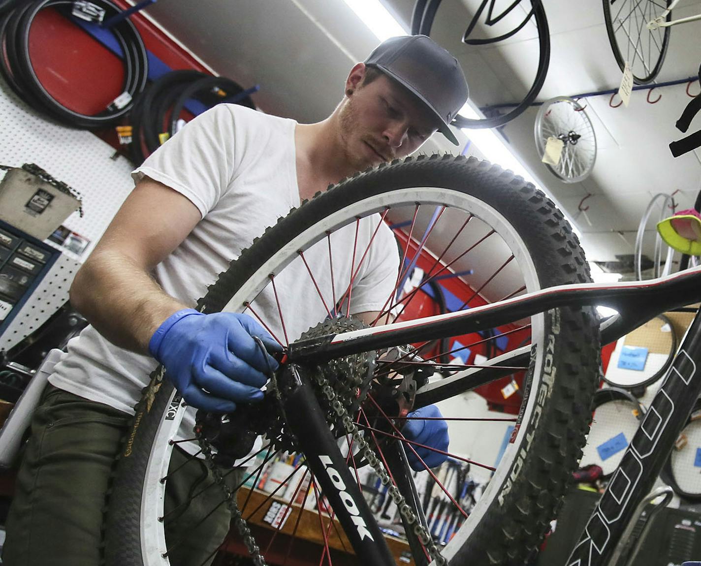 Store manager Brandon Stahnke works on a bike at Art Doyle&#x201a;&#xc4;&#xf4;s Spokes and Pedals Friday, Sept. 26, 2014, in Hudson, WI.](DAVID JOLES/STARTRIBUNE)djoles@startribune.com Another in a monthly series highlighting day trips from the Twin Cities, places to eat , things to do and see.**Brandon Stahnke,cq