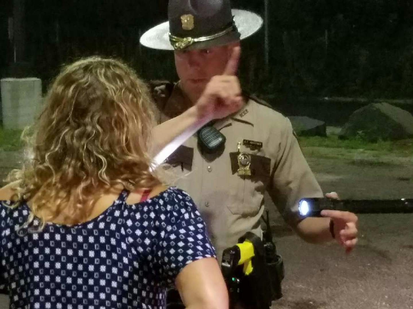 State Trooper Andrew Martinek checks for signs of impairment during a traffic stop in downtown Minneapolis.