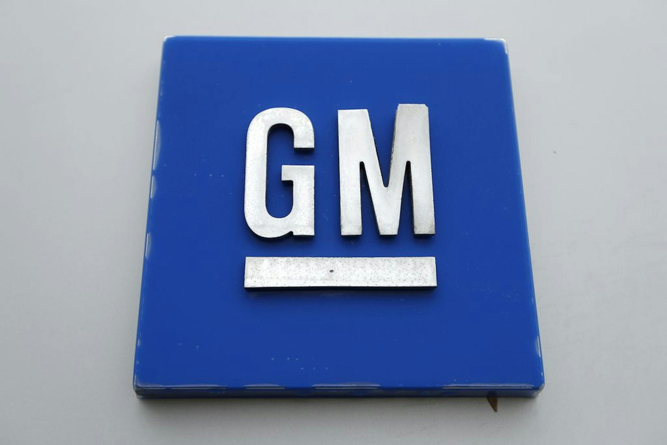 FILE - This Jan. 27, 2020 file, photo shows the General Motors logo in Hamtramck, Mich. General Motors is recalling more than 217,000 vehicles in the U.S. and Canada because transmission oil can leak, causing them to stop or catch fire.