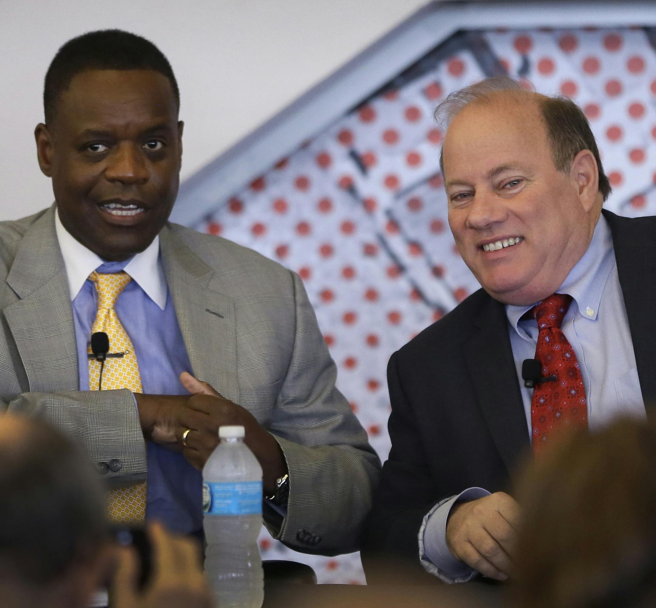 State-appointed Emergency Manager Kevyn Orr, left, and Mayor Mike Duggan are seen during a news conference in Detroit, Tuesday, May 27, 2014. Removing blighted residential properties, lots and vacant commercial structures that have plagued Detroit neighborhoods for decades would cost $850 million, a task force said Tuesday. Blight has "gone on for years" without a "real strategy" and has gotten worse as a result, said Duggan. Orr called it an unprecedented effort. For the first time in Detroit's