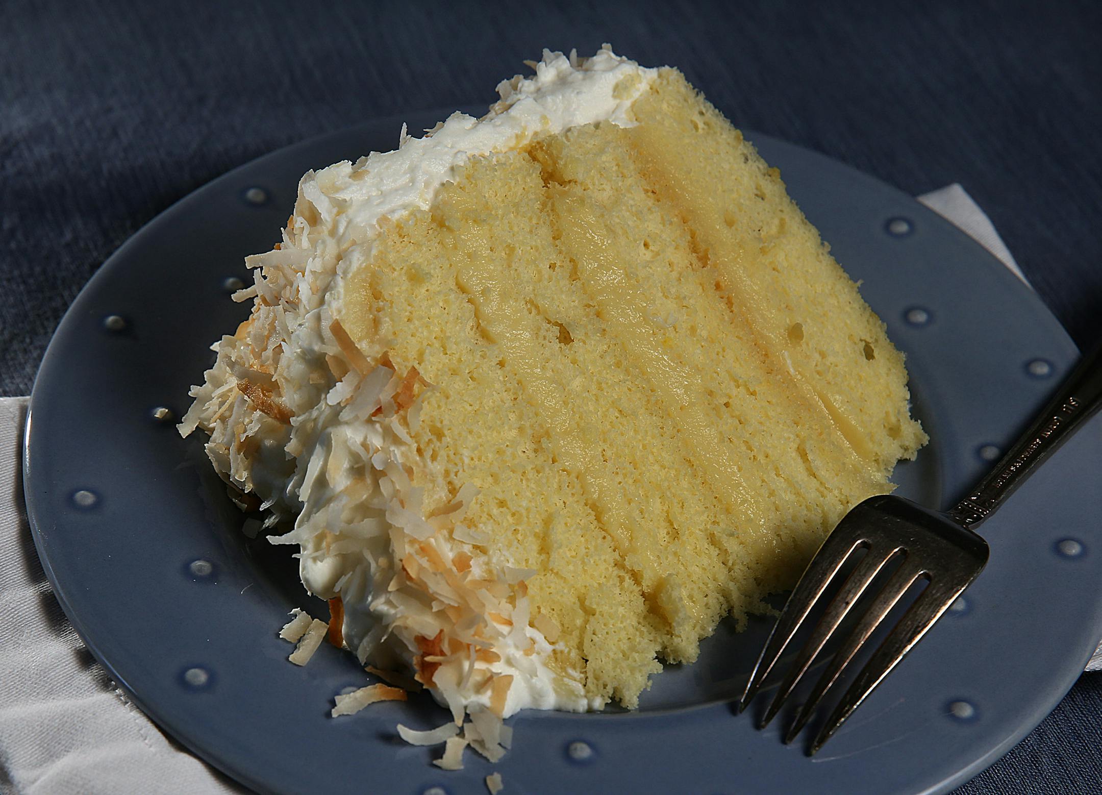 Coconut cake.] JIM GEHRZ ‚Ä¢ jgehrz@startribune.com / Minneapolis, MN / April 4, 2014 / 1:00 PM BACKGROUND INFORMATION: Reporter Kim Ode bakes a coconut cake for Baking Central, complete with step-by-step photos showing the making of batter and custard, assembling and decorating.