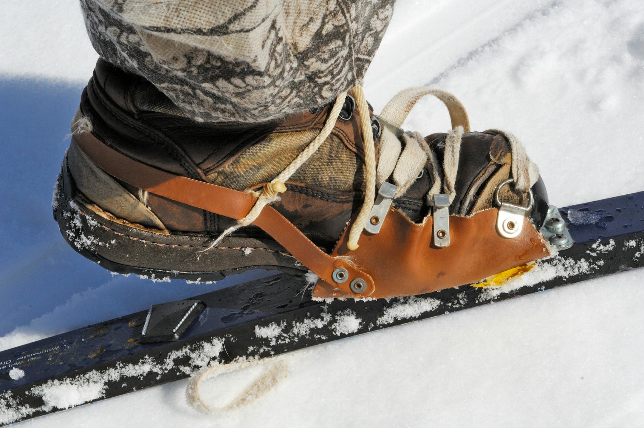 Retrofitting pivot-type snowshoe bindings to a pair cross-country skis, allows the user to wear comfortable winter boots instead of the less-functional cross-counrty boots.