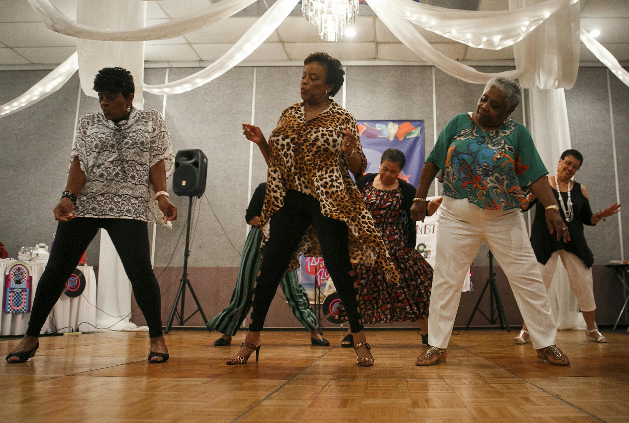 From left to right, Patricia Wyche, Corenthia Picou and Eunice Sample dance to "Bikers Shuffle" by Big Mucci during the Not Back to School luncheon held at Grand Affairs in Virginia Beach, Va., on Tuesday, September 3, 2019. All three ladies retired from Norfolk Public Schools with over 35 years of service. (Kristen Zeis/Virginian Pilot/TNS) ORG XMIT: 1418370 ORG XMIT: MIN1909091425318340