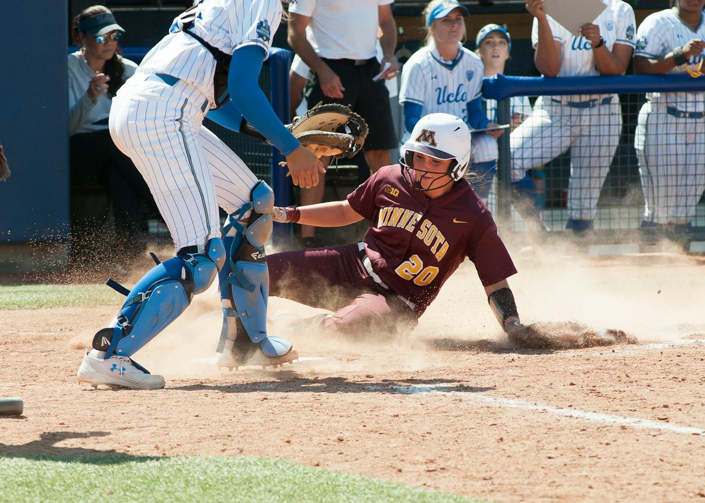 Maddie Houlihan slid into home vs. UCLA in the first game of the Women's College World Series but the Gophers could only get two runs in and lost the game.