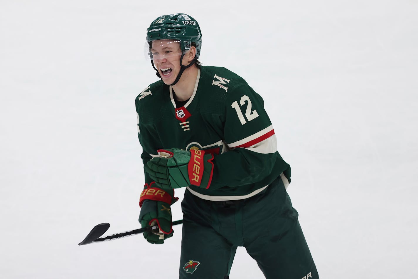 Minnesota Wild left wing Matt Boldy (12) reacts after scoring a goal against the Los Angeles Kings during the first period of an NHL hockey game Sunday, April 10, 2022, in St. Paul, Minn. (AP Photo/Stacy Bengs)