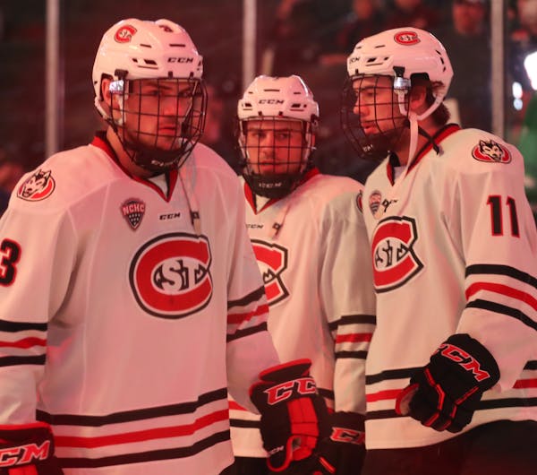 Brothers Jack (3), Nick (center) and Ryan (11) Poehling were together before lineups were announced at the SCSU game against Colorado College in the 2