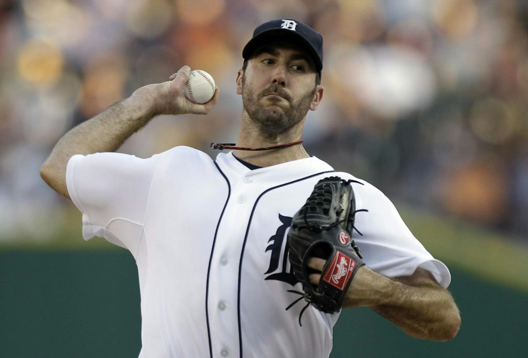 Detroit Tigers pitcher Justin Verlander throws against the Minnesota Twins in the first inning of a baseball game in Detroit, Tuesday, Aug. 16, 2011.