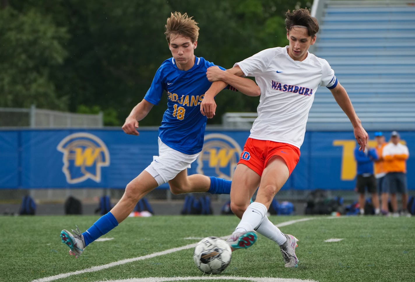 Wayzata's Miles Redmond (18) and Washburn's Nels Mortenson (8) get tied up while battling for a loose ball at Wayzata High School in Plymouth, Minn., on Saturday, Sept. 9, 2023. Wayzata defeated Washburn 5-1.