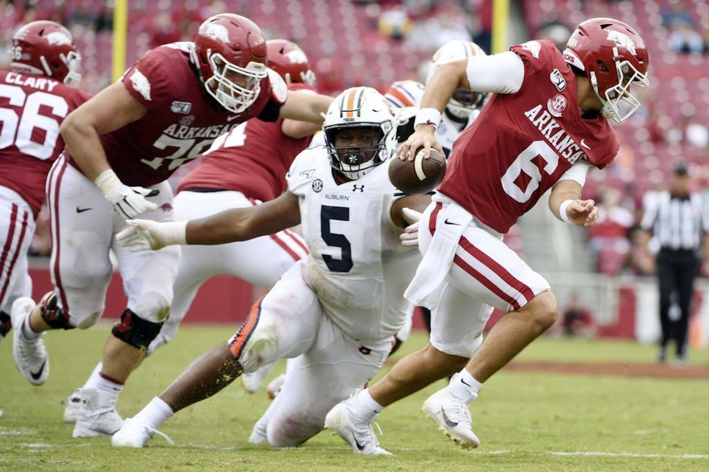 Auburn defensive tackle Derrick Brown (5) pressures Arkansas quarterback Ben Hicks earlier this season. He is among the top defensive players in the nation.