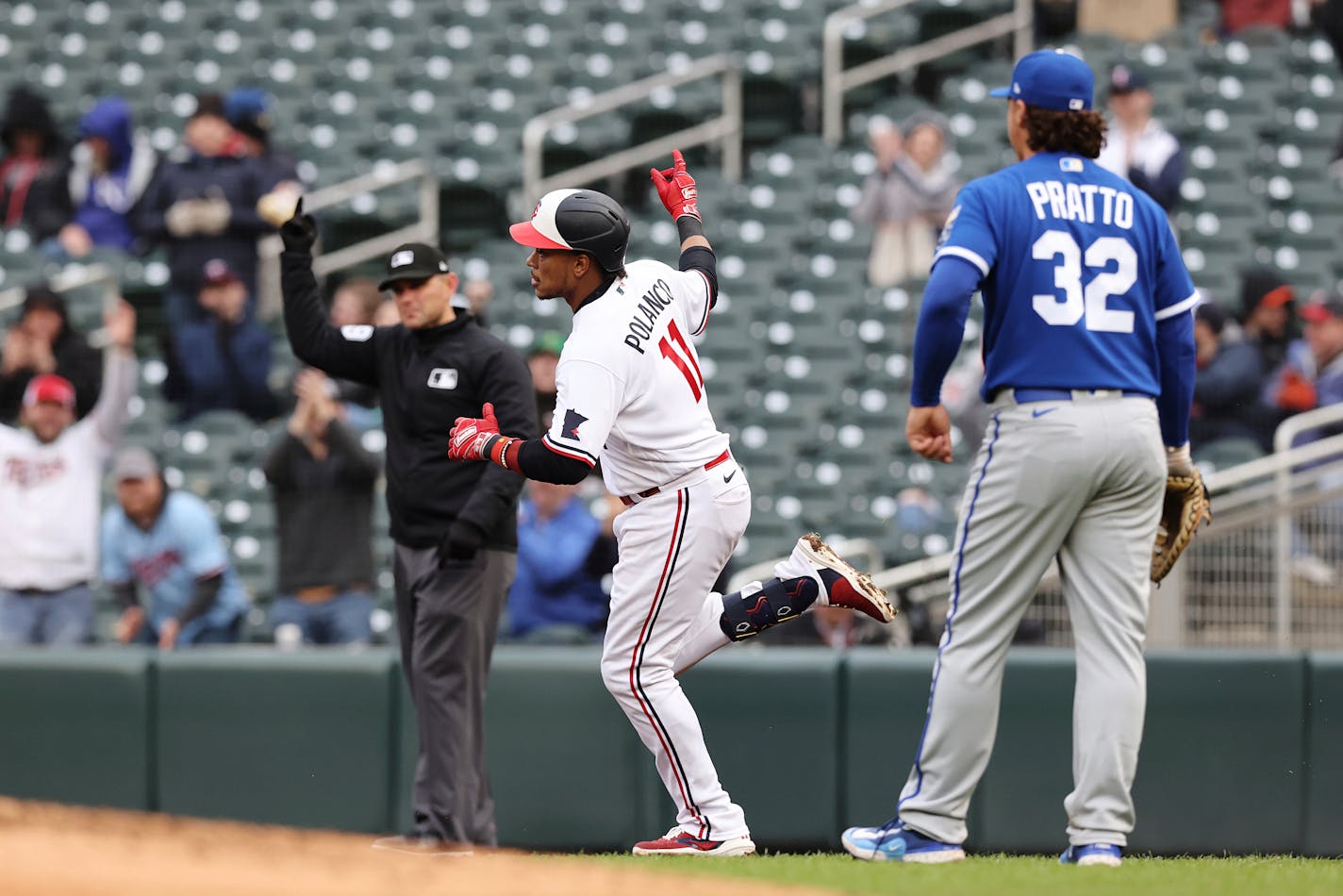 Jorge Polanco rounds first base after hitting a home run against the Royals on Friday