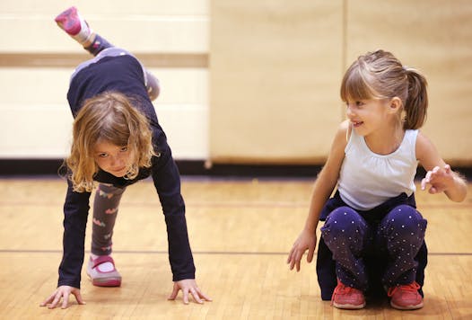 Avery Dorwart, left, and Emma Goodman held a pose during the class, which teaches improvisation skills.