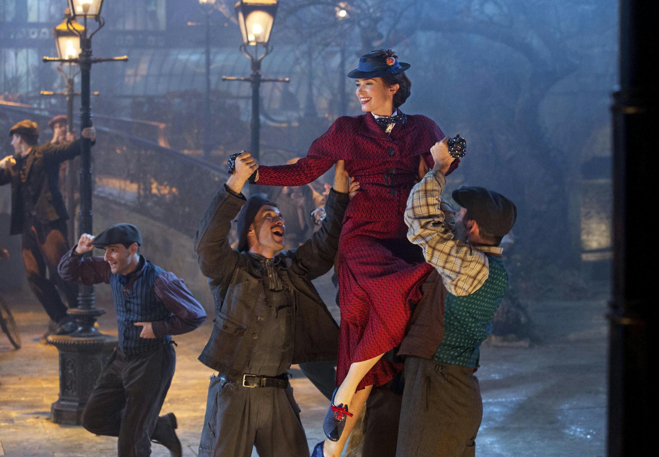 This image released by Disney shows Emily Blunt as Mary Poppins in "Mary Poppins Returns." (Jay Maidment/Disney via AP)