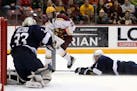 Minnesota Golden Gophers forward Tyler Sheehy (22) watches as he's unable to get a shot past Penn State Nittany Lions goaltender Chris Funkey (33) dur