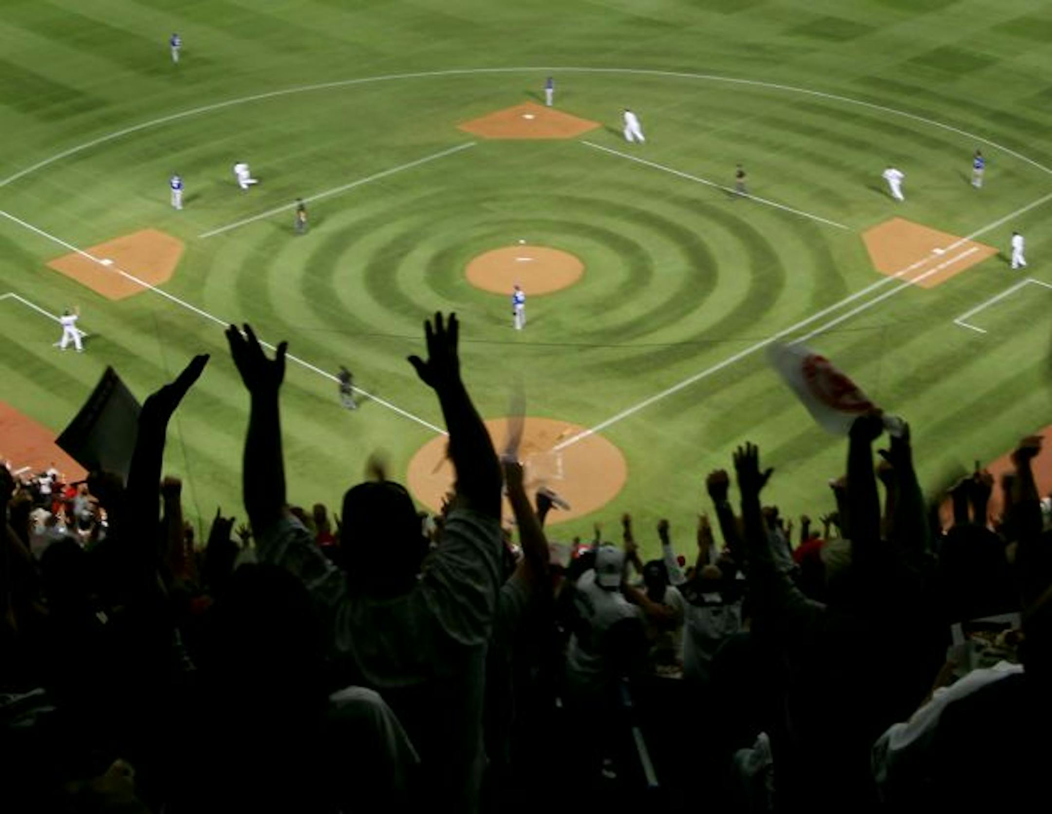 Twins fans in the upper deck celebrate a three run homerun by Twins Jason Kubel in the 3rd inning.