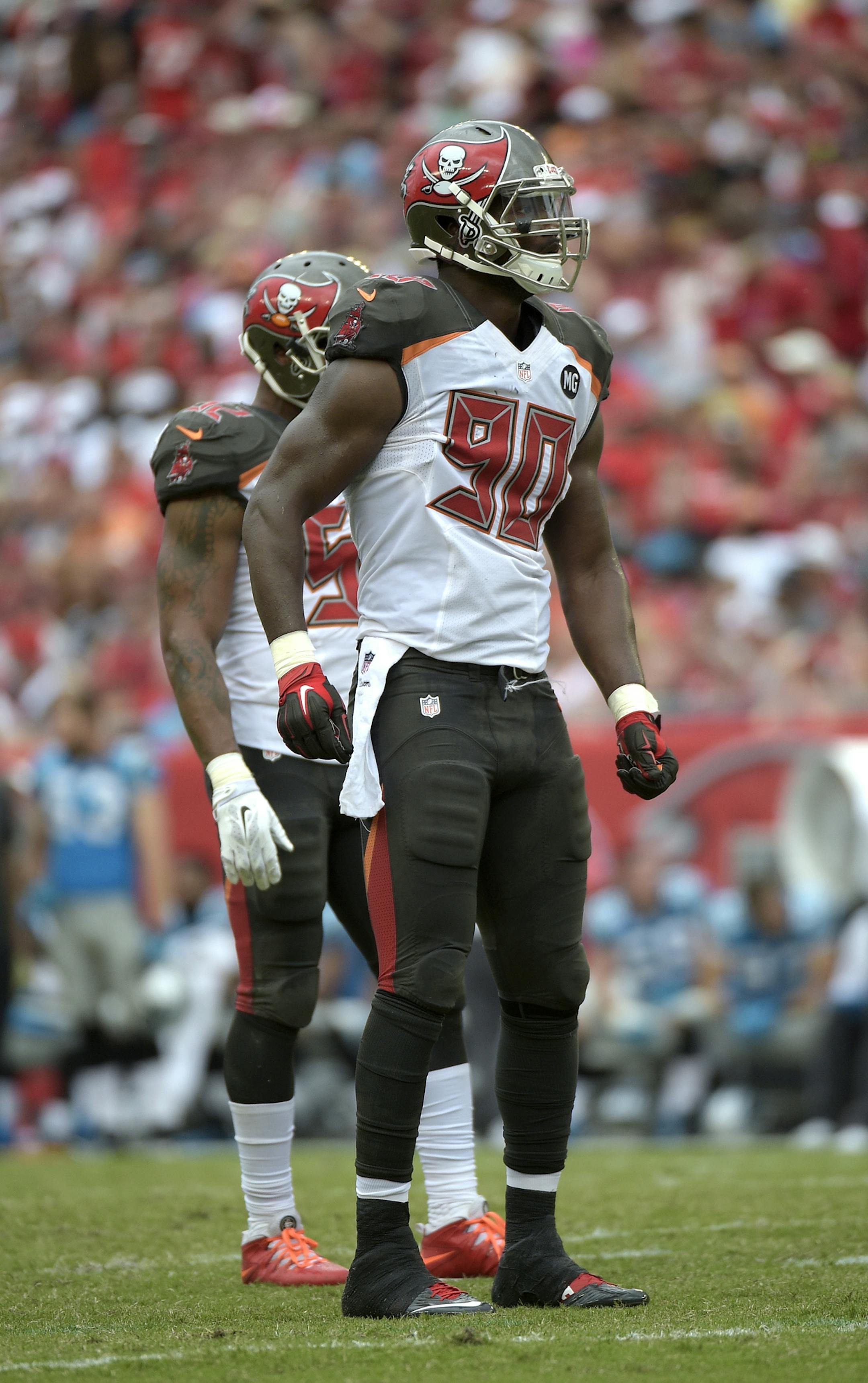 Tampa Bay Buccaneers defensive end Michael Johnson (90) waits for a play at the line of scrimmage during the second half of an NFL football game against the Carolina Panthers in Tampa, Fla., Sunday, Sept. 7, 2014.(AP Photo/Phelan M. Ebenhack) ORG XMIT: MIN2014102219394484
