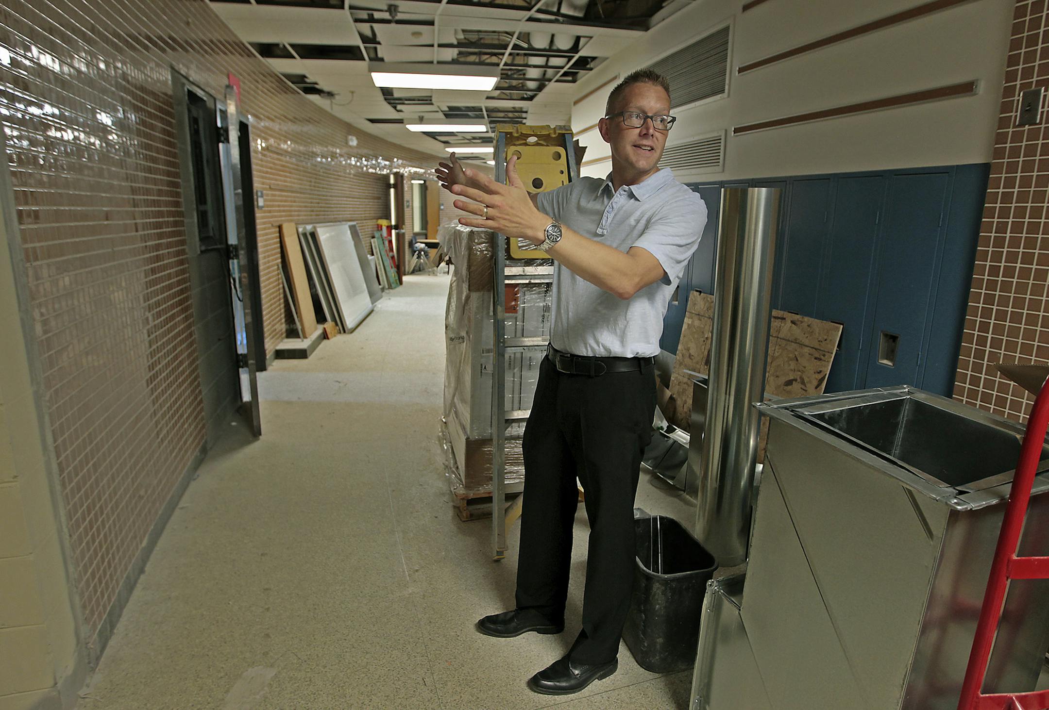 Sand Creek Elementary principal Paul Anderson gave a tour of the 12,000-square-foot addition and renovations to the elementary school, Tuesday, August 5, 2014 in Coon Rapids, MN. The move to all-day kindergarten has led to a scramble to get space ready in the Anoka-Hennepin School District. Workers have been constructing additions to six schools since this spring in hopes of meeting a tight Aug. 15 deadline. ] (ELIZABETH FLORES/STAR TRIBUNE) ELIZABETH FLORES • eflores@startribune.com