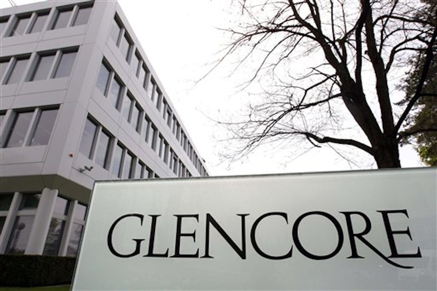 FILE - This April 14, 2011 file picture shows the Glencore headquarters in Baar, Switzerland. Commodities trader Glencore says Chinese regulators have approved its proposed merger with mining company Xstrata PLC. The Swiss-based supplier of raw materials such as oil, copper and wheat says the merger was cleared by China's Ministry of Commerce subject to certain conditions. Among those, says Glencore, which also owns plants, warehouses and mines, is that the company must sell all of its post-merg