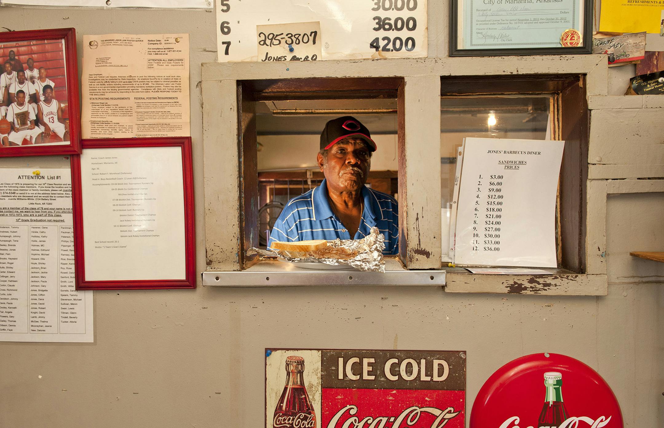 Jones Bar-B-Q Diner owner and pitmaster James Jones - who won an America's Classics award from the James Beard Foundation in 2012 - at his Marianna, Ark., restaurant. The price of a barbecue pork sandwich rose to $3.50 after this photo was taken. (Arkansas Department of Parks and Tourism)