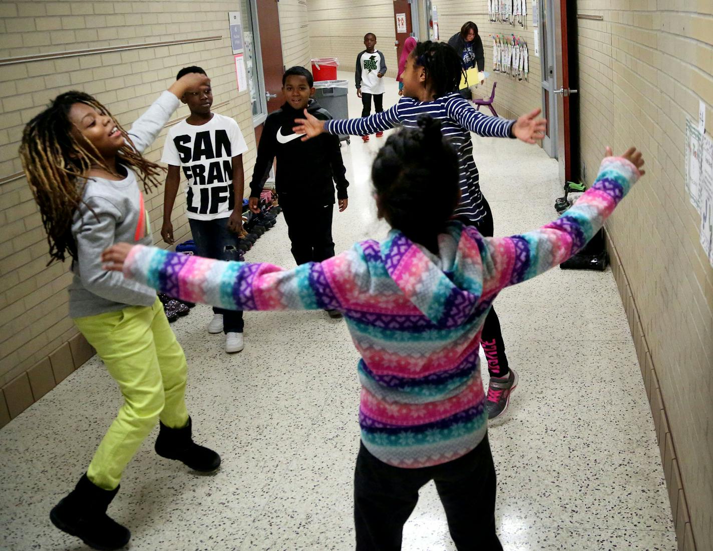 Students at Tanglen Elemetary School, with the help of a school counselor, are figuring out ways to move during recess without having to freeze outside. They do this with eight different activity stations, some incorporating breathing exercises, some yoga and other more standard exercises. Here, third graders do jumping jacks as another group on recess rotates to the jumping jacks station Thursday, Jan. 5, 2017, in Minnetonka, MN. ](DAVID JOLES STARTRIBUNE)djoles@startribune.com Teachers are fin