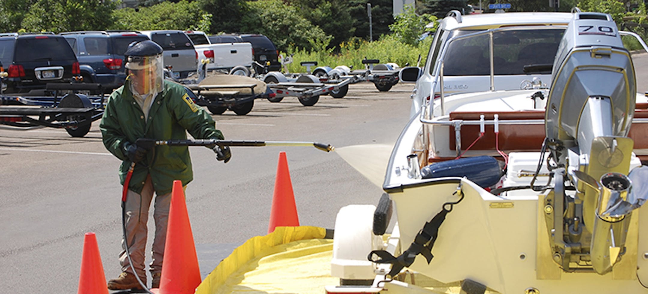 At Grays Bay in Lake Minnetonka, watercraft inspector Richard Rowland decontaminated a boat.
