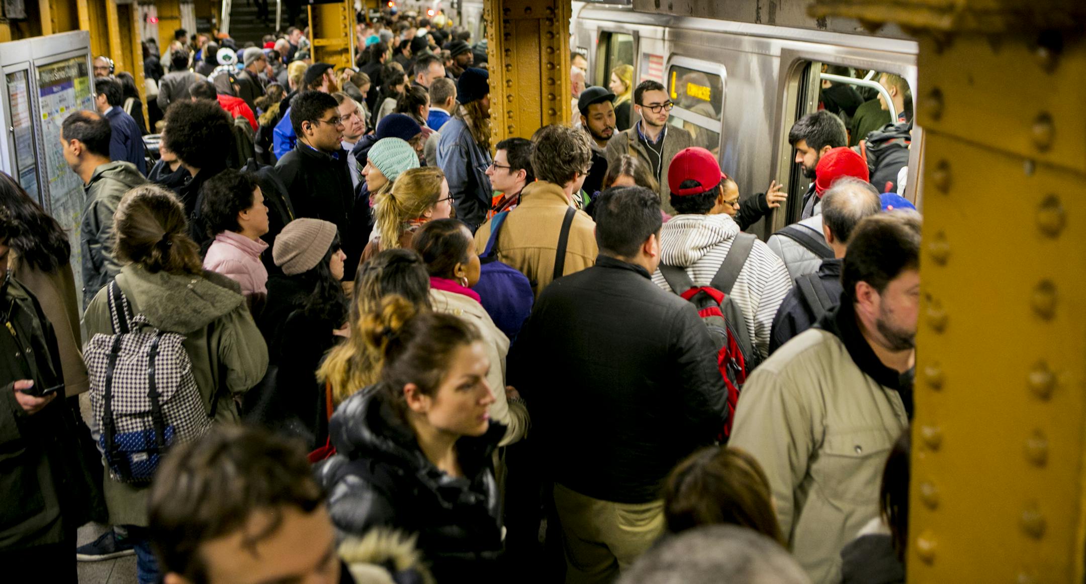 FILE- Passengers navigate a crowded subway platform as they get on and off the L train at Union Square in Manhattan, April 4, 2016. The subway is at nearly six million riders a day in 2017 &#xd1; the highest since the 1940s. Commuters are cramming onto a system that has been essentially the same size for decades. (Sam Hodgson/The New York Times)