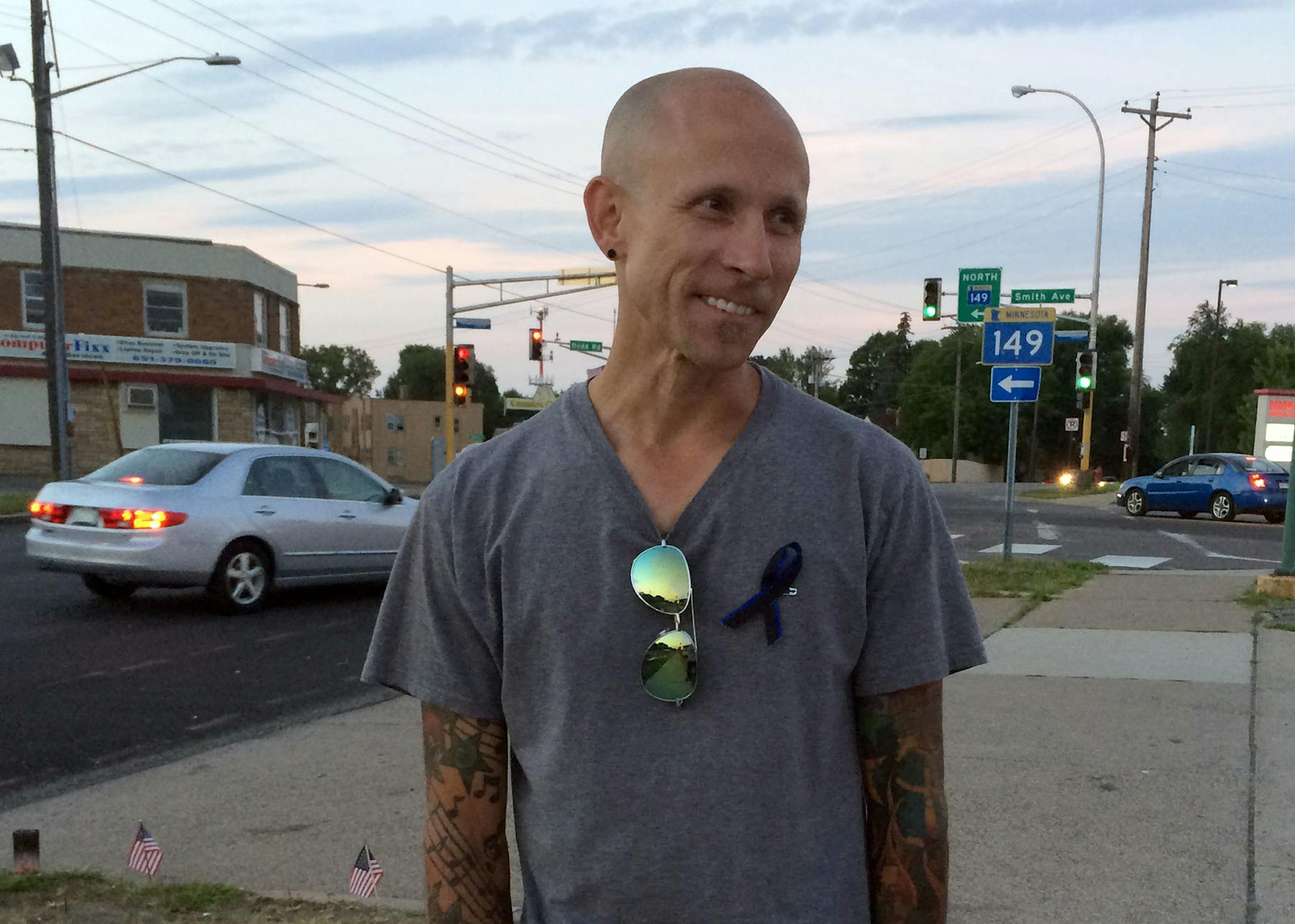 Jason Serbesku got a ticket, and a long talk, from officer Scott Patrick last December. After the fatal shooting, he felt moved to help tend the memorial.