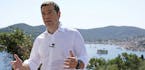 In this photo released by Greek Prime Minister's office, Greek Prime Minister Alexis Tsipras delivers a speech from the western Greek island of Ithaca