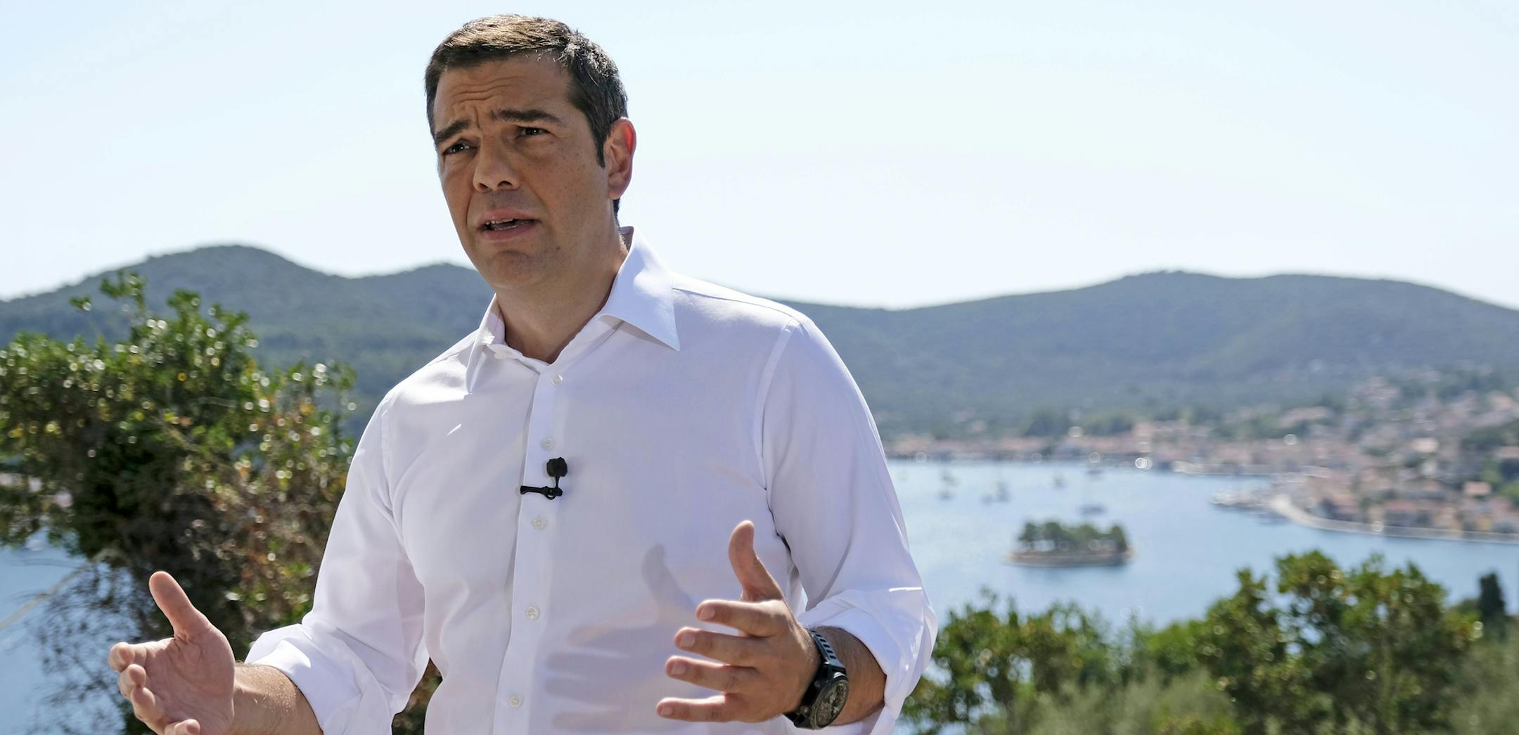 In this photo released by Greek Prime Minister's office, Greek Prime Minister Alexis Tsipras delivers a speech from the western Greek island of Ithaca, legendary home of the ancient mariner Odysseus, hero of Homer's Odyssey epic, on Tuesday, Aug. 21, 2018. Speaking to local officials on the island, Tsipras compared Greece's bailout travails with those of Odysseus. Greece remains shackled to the austerity demands of its former creditors even though it officially entered its post-bailout era Tuesd