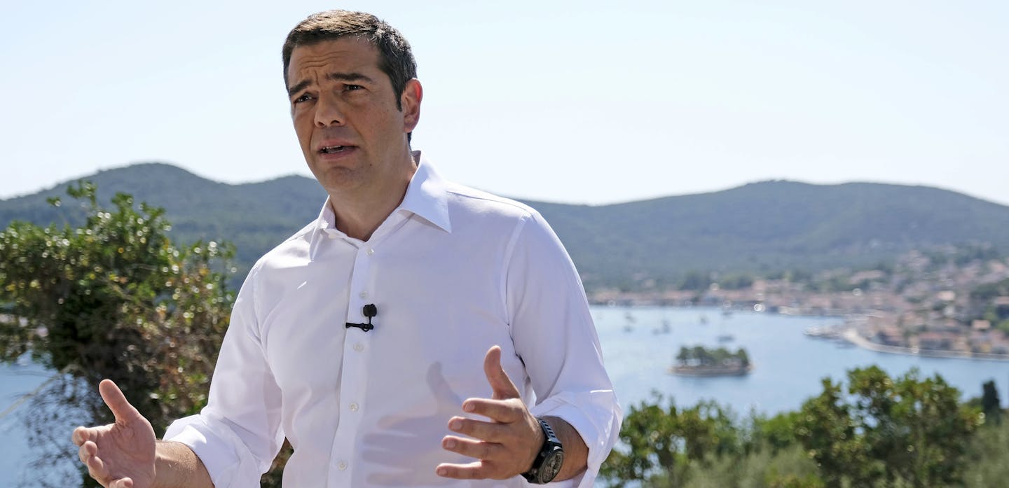 In this photo released by Greek Prime Minister's office, Greek Prime Minister Alexis Tsipras delivers a speech from the western Greek island of Ithaca, legendary home of the ancient mariner Odysseus, hero of Homer's Odyssey epic, on Tuesday, Aug. 21, 2018. Speaking to local officials on the island, Tsipras compared Greece's bailout travails with those of Odysseus. Greece remains shackled to the austerity demands of its former creditors even though it officially entered its post-bailout era Tuesd