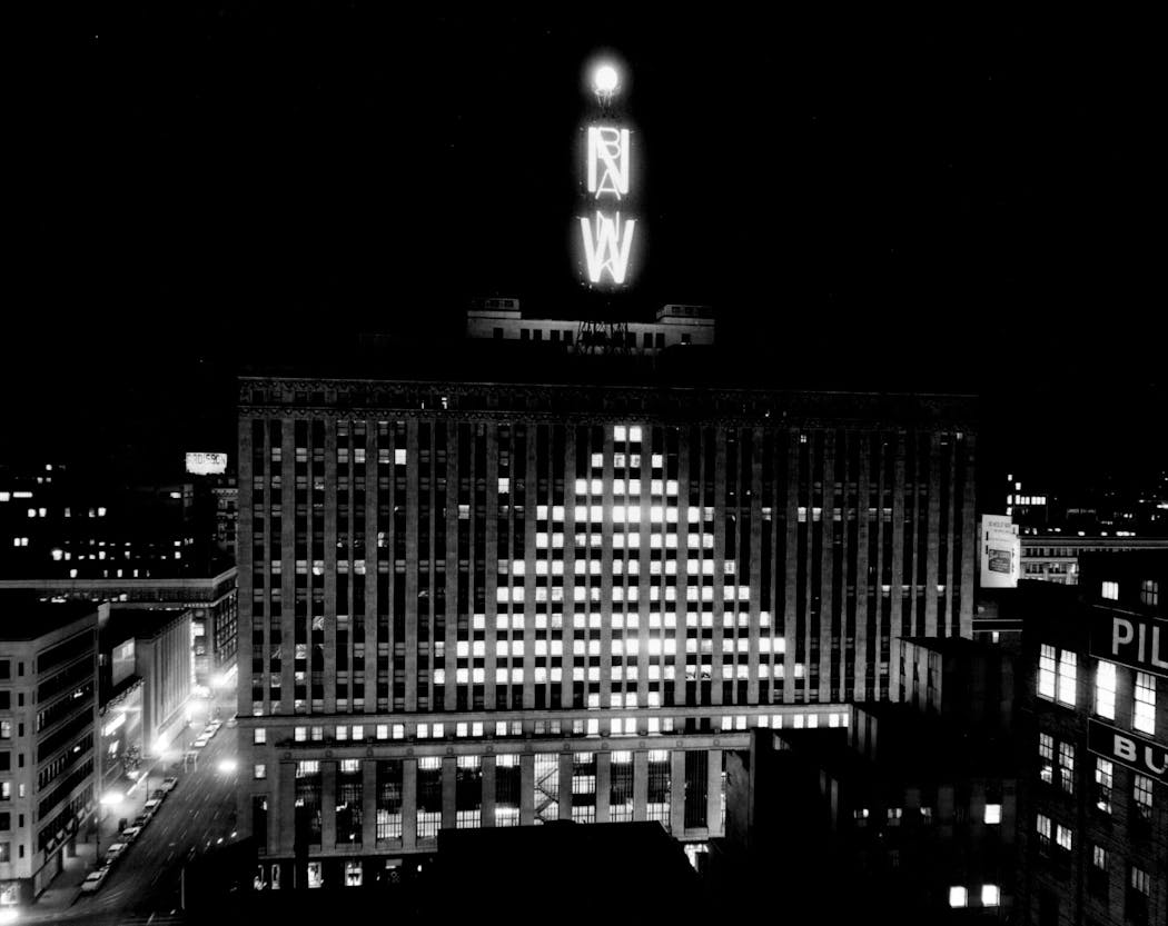 The Northwestern National Bank building lit up in the shape of a Christmas tree in December 1958.