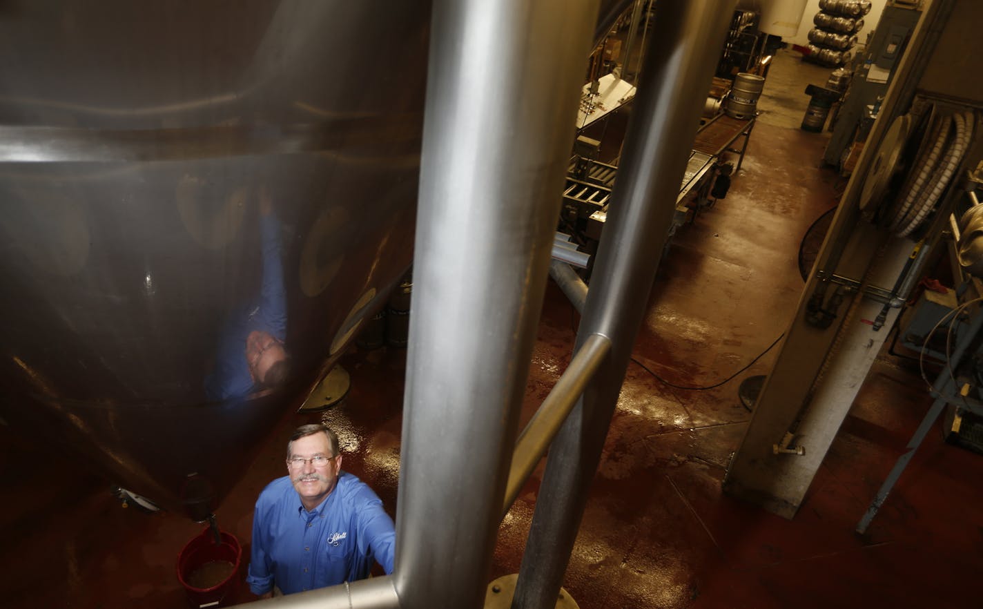 In New Ulm at the August Schell Brewery, Ted Marti is the fifth generation brewer. He is standing next to one of the modern brewing vats.] rtsong-taatarii@startribune.com