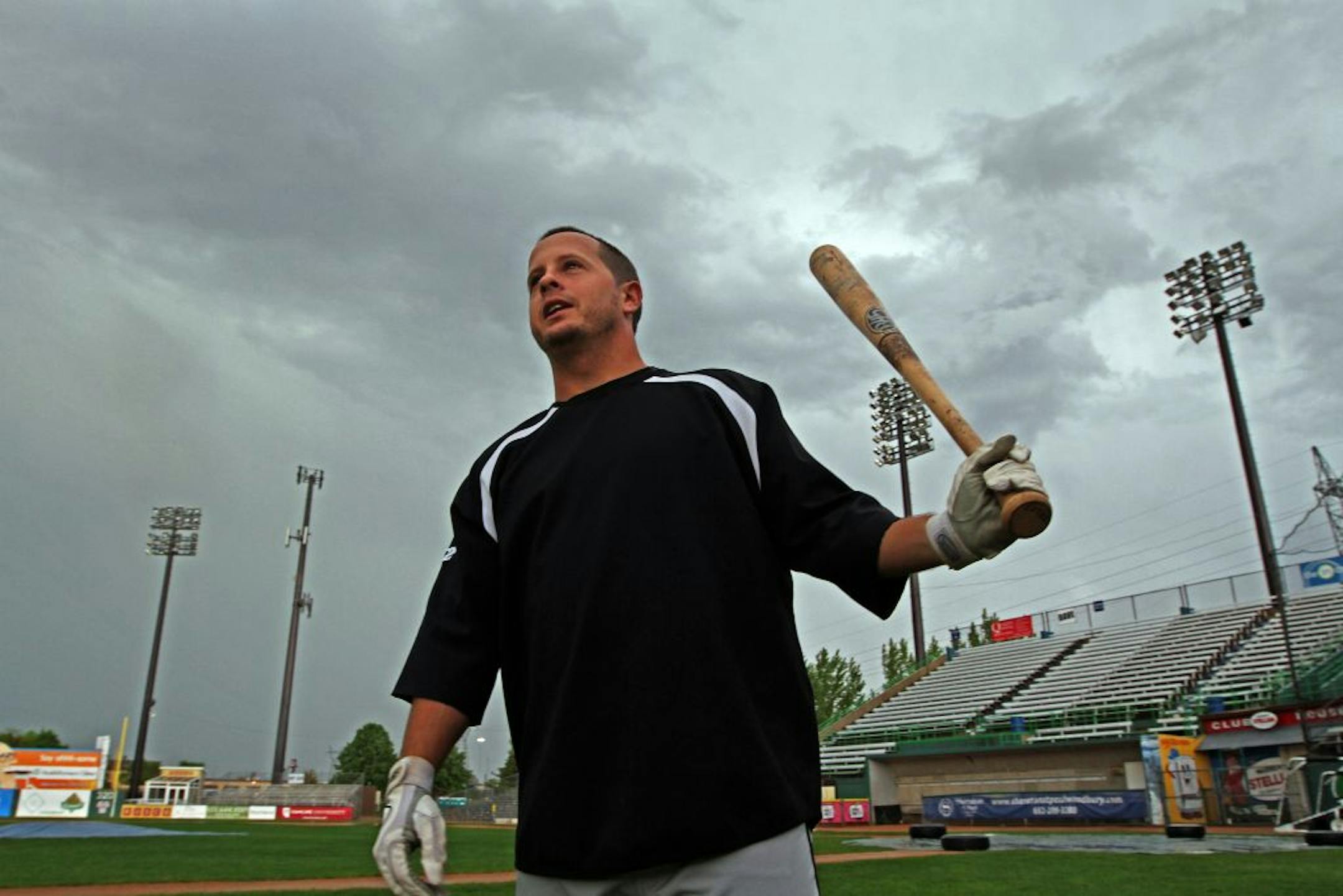 Middle infielder Chris Cates checked out the field at Midway Stadium after a thunderstorm shut down the St. Paul Saints' annual tryout.