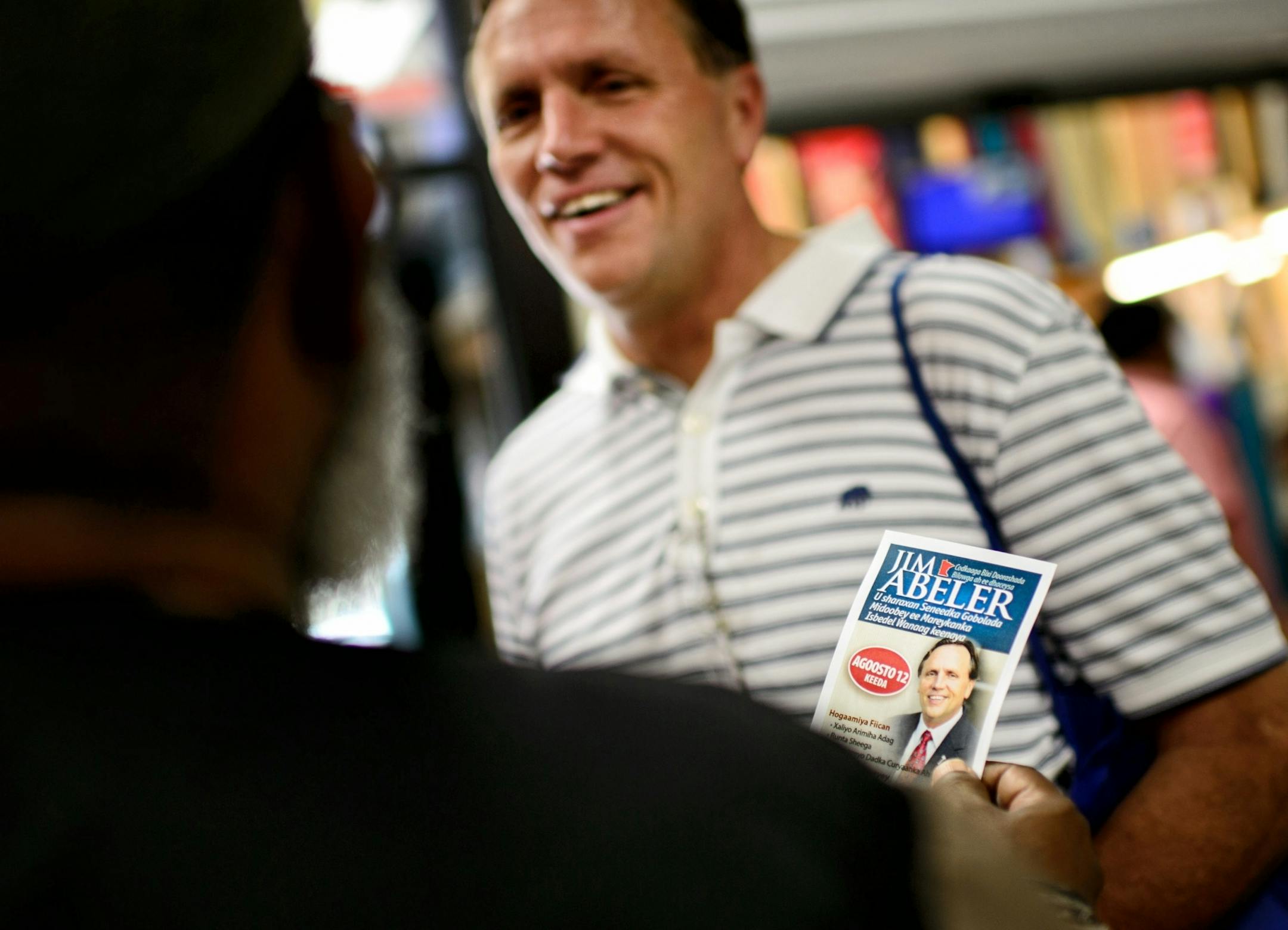 State Rep. Jim Abeler asked Somalis for their vote in the August 12 primary in his race against Mike McFadden to go up against Sen. Al Franken for the U.S. Senate seat. He handed out brochures in both English and Somali Friday after prayers at Somali Village Market in Minneapolis.