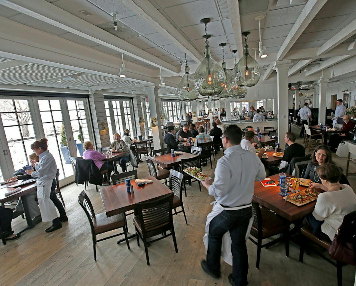 File photo of the lunch rush at Cov restaurant, one of the several new restaurants to open in Wayzata in the last year, spurring the city to look at finding new parking options for growing crowd of visitors to the lakeside town. File photo by Elizabeth Flores of Feb. 20, 2015.