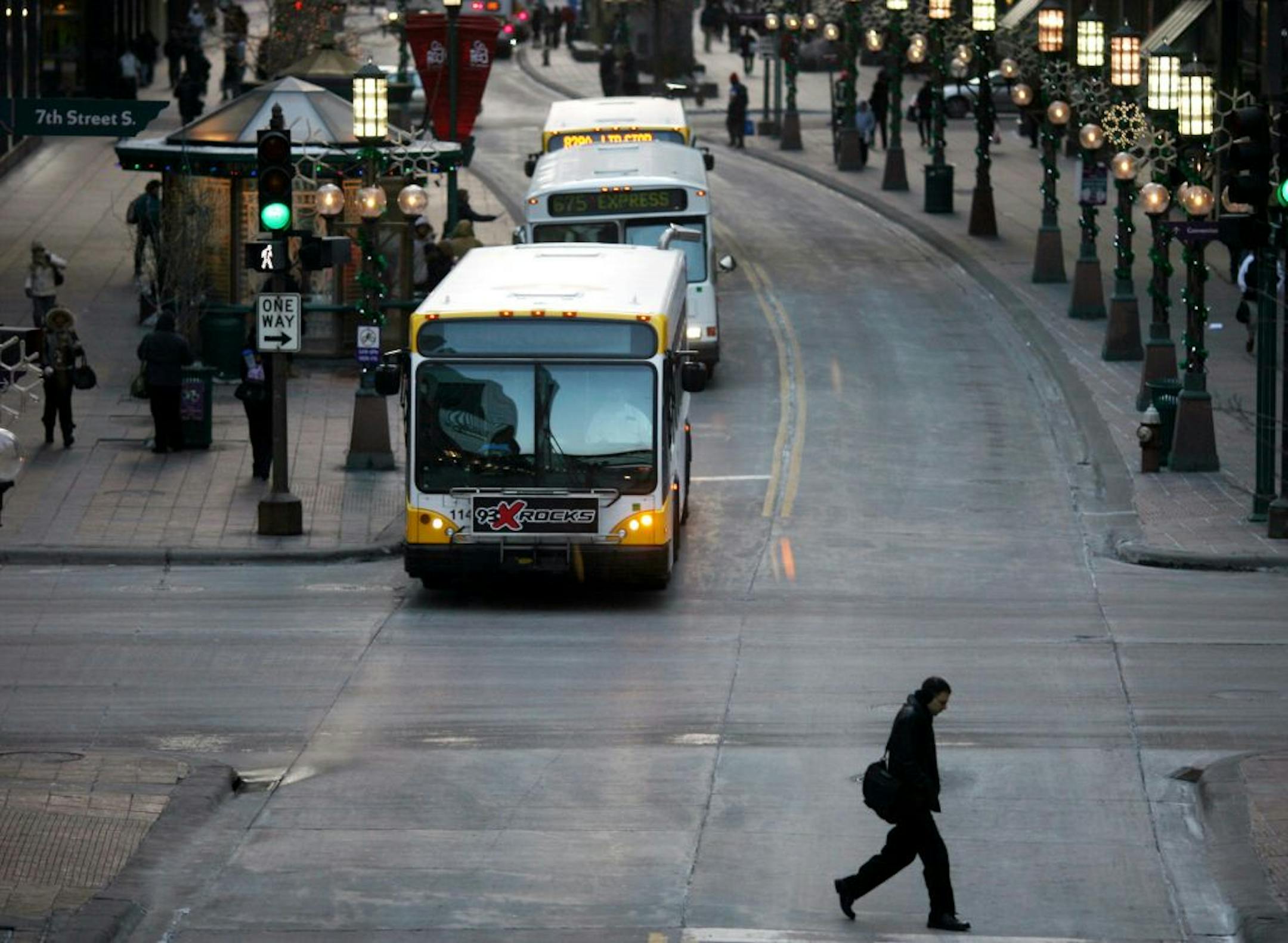jgholt@startribune.com 2/2/2009-----A pedestrian crossed Nicollet Mall as buses picked up passengers Monday afternoon in down town Minneapolis.