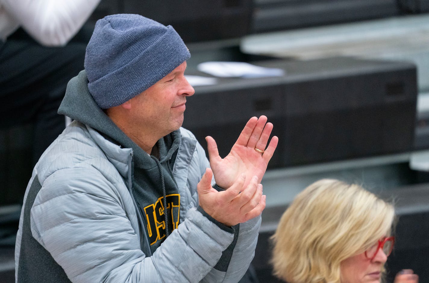 David Flom, the suspended head coach of the Eden Prairie boy's basketball team watches their game against Farmington from the bleachers Friday, Dec. 16, 2022 at Farmington High School in Farmington, Minn. ]