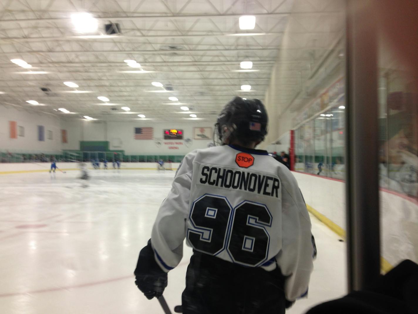 Eastview Pee-wee hockey player Matthew Schoonover wore his brother Patrick's No. 96 jersey in his team's game against Eagan on Sunday at Hayes Arena in Apple Valley. Both teams dropped to one knee for a moment of silence for Patrick, who died after collapsing during a game Friday in Brainerd. Most of the kids in attendance Sunday wore their jerseys with Patrick's name taped over their own names.