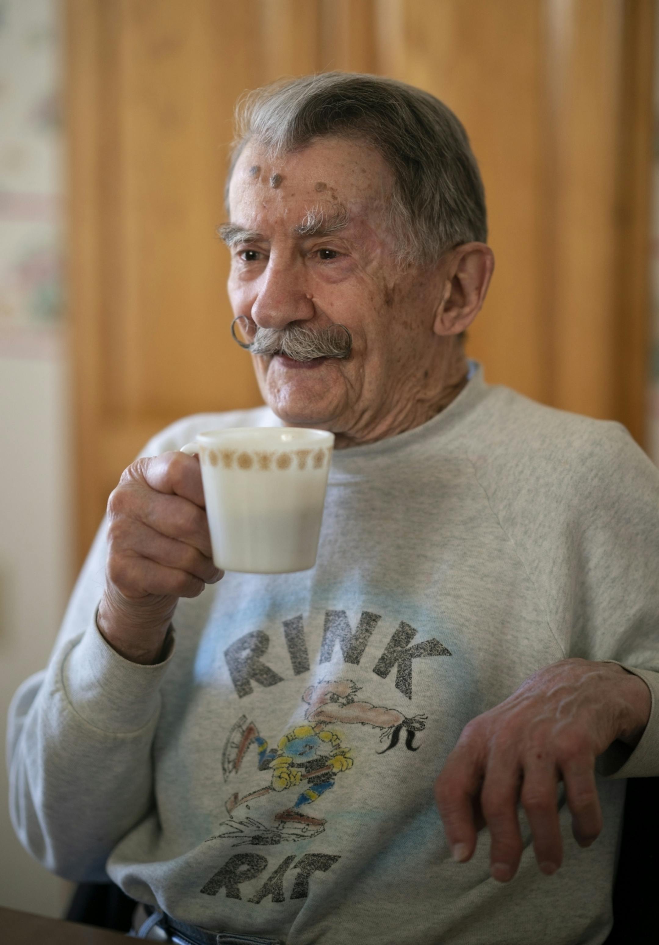 Mark Sertich drank coffee with a couple of teammates who stopped by after their game Thursday morning.