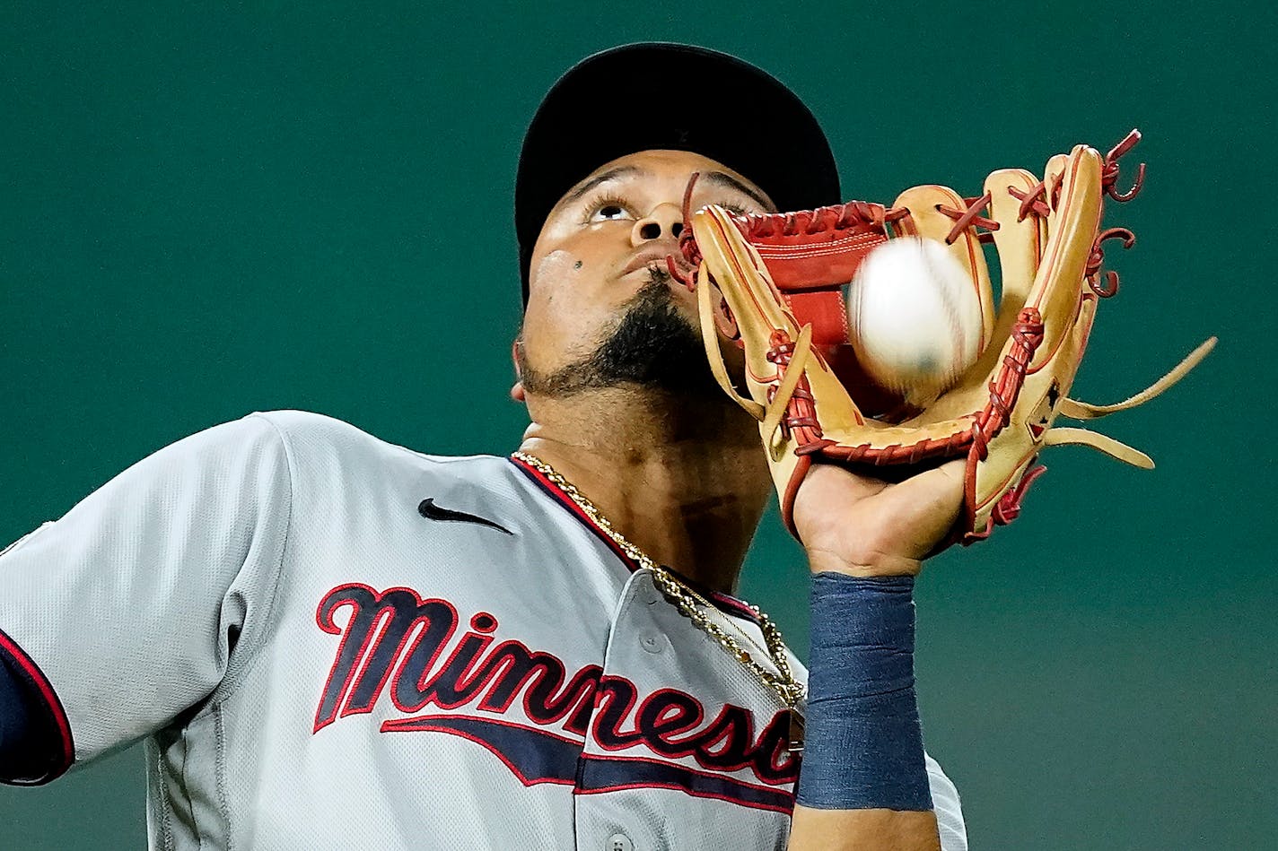 Minnesota Twins second baseman Luis Arraez catches a fly foul ball for the out on Kansas City Royals' Michael A. Taylor during the fifth inning of a baseball game Saturday, Oct. 2, 2021, in Kansas City, Mo. (AP Photo/Charlie Riedel)