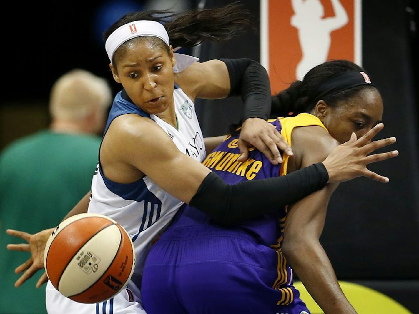 Lynx forward Maya Moore, left, fought for a loose ball with Nneka Ogwumike in the fourth quarter of a game last season.