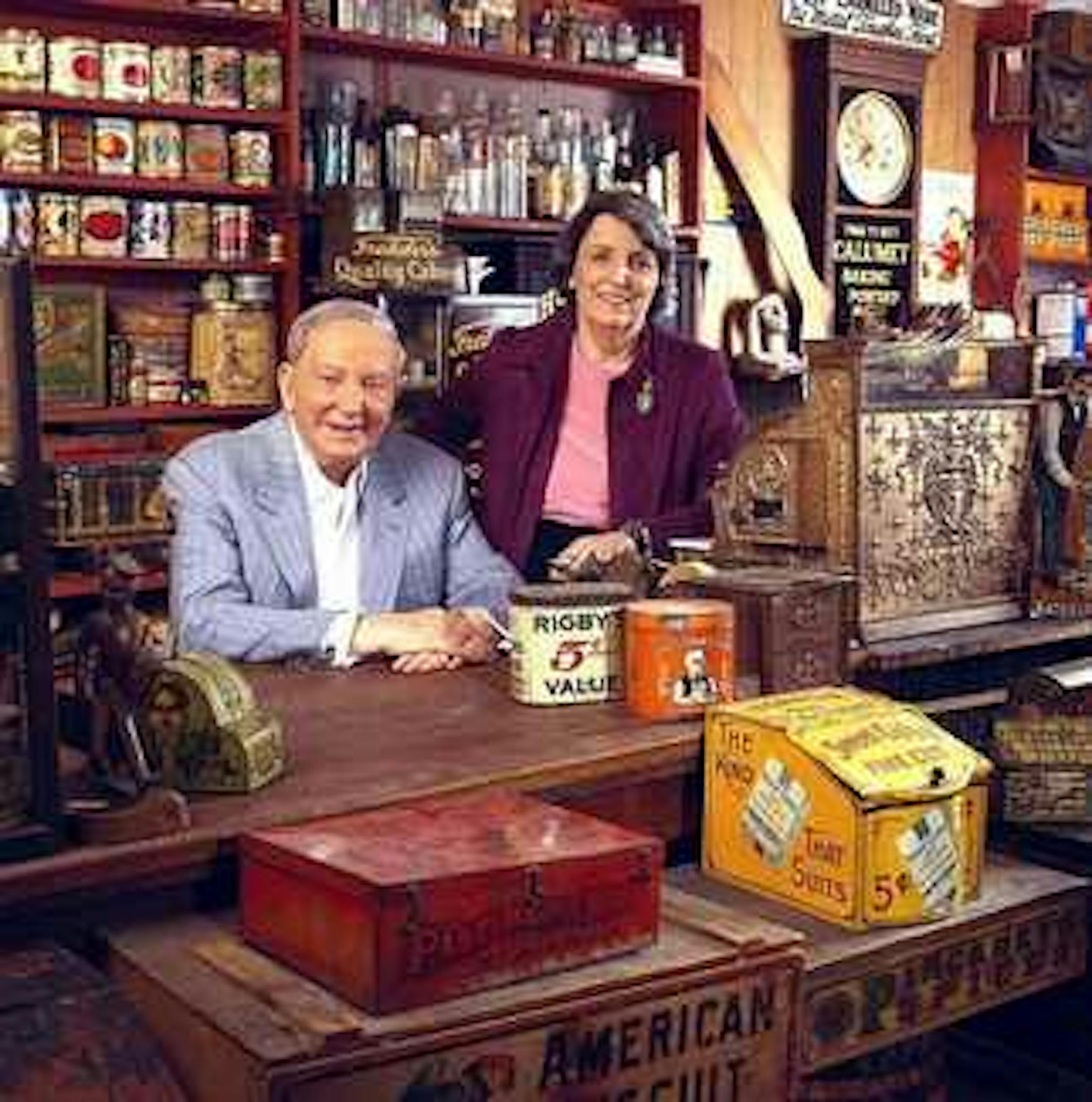 Ralph and Terry Kovel, the antiques kings, shown here in their home which they've decorated in part to look like a country store.
