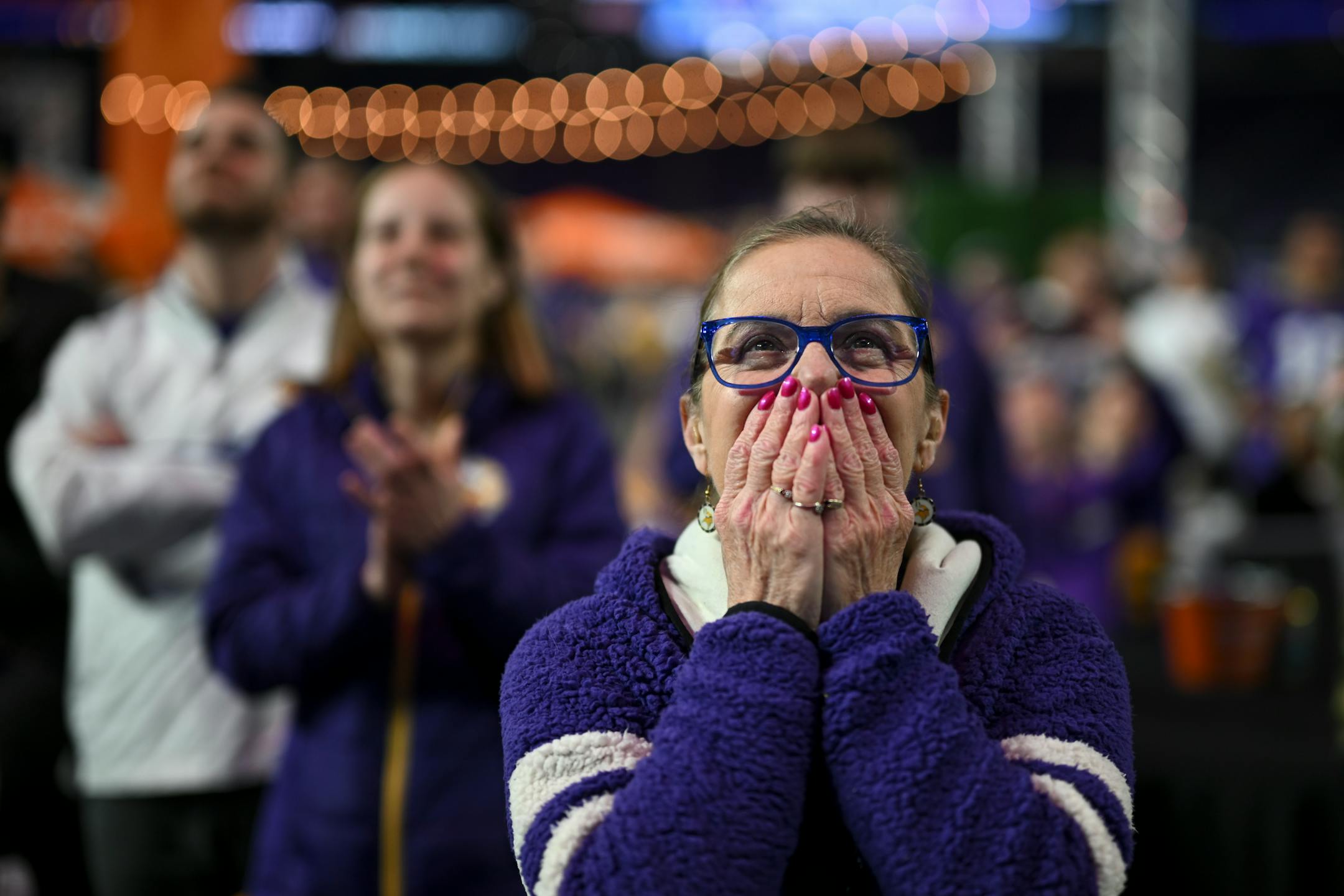 Carol LeDuc-Hauser waits in angst for the Vikings to announce their first-round pick during the Vikings NFL Draft Party .