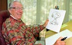 Cartoonist Charles Schulz displayed a sketch of his beloved character "Snoopy."
